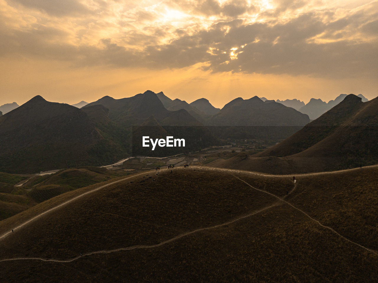 scenic view of landscape against sky during sunset
