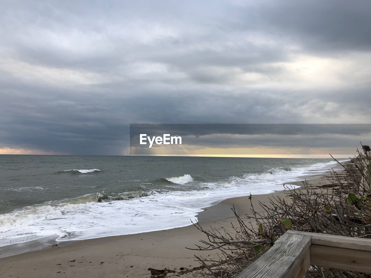 SCENIC VIEW OF BEACH BY SEA AGAINST SKY