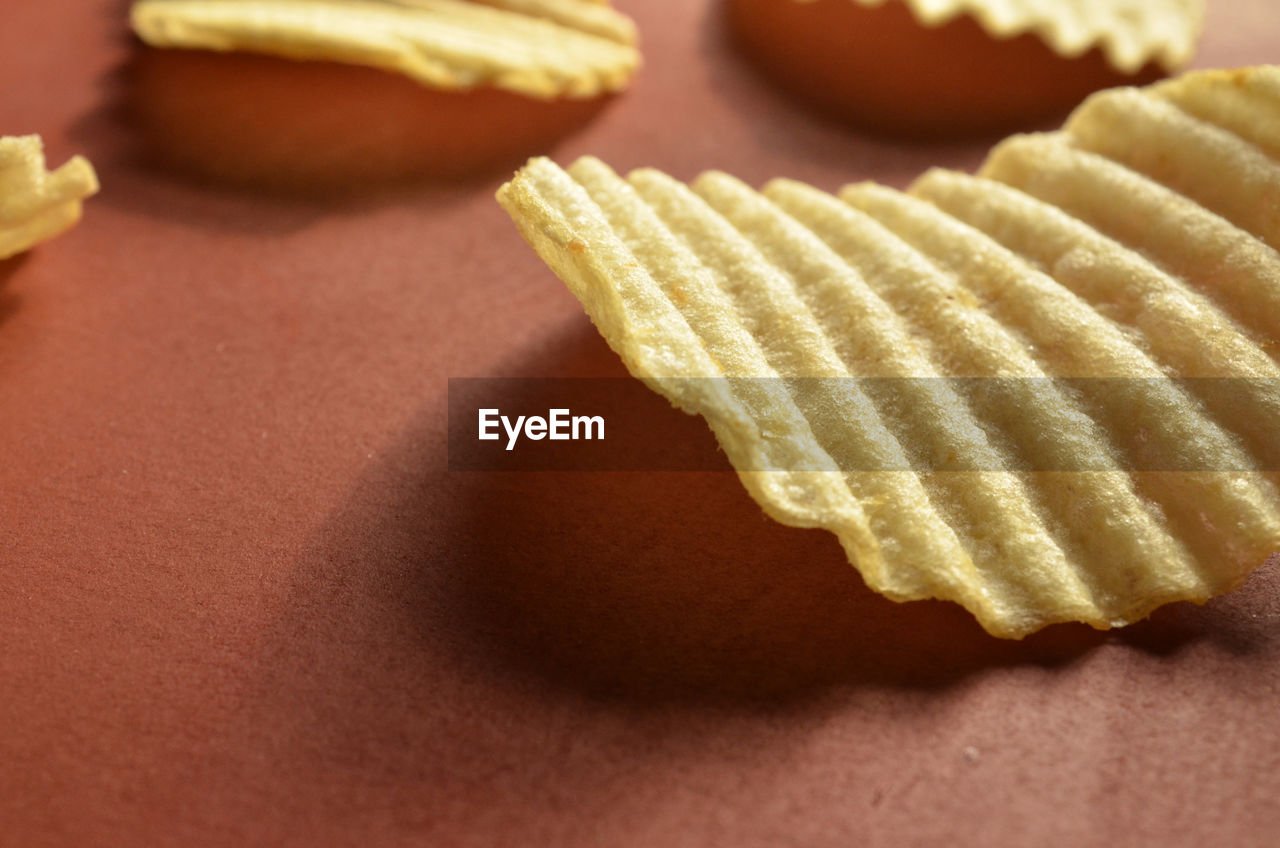 Close-up of potato chips on table