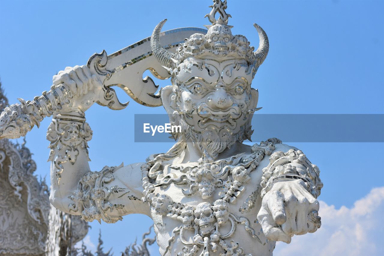 Sculpture at white temple in chiang rai, thailand