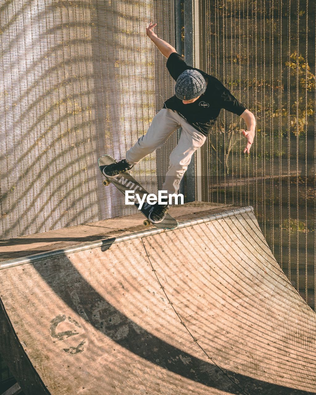 MAN SKATEBOARDING ON SKATEBOARD