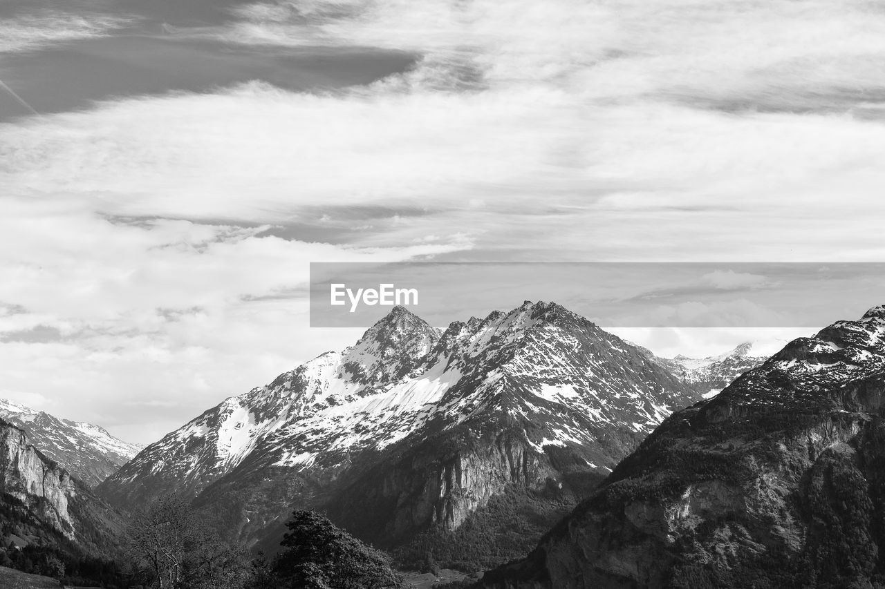 Scenic view of snowcapped mountains against sky