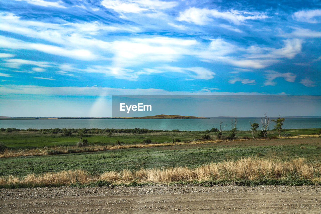 SCENIC VIEW OF LANDSCAPE AGAINST BLUE SKY