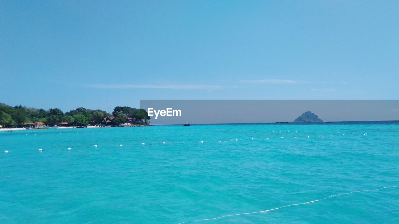 SCENIC VIEW OF SEA AGAINST BLUE SKY