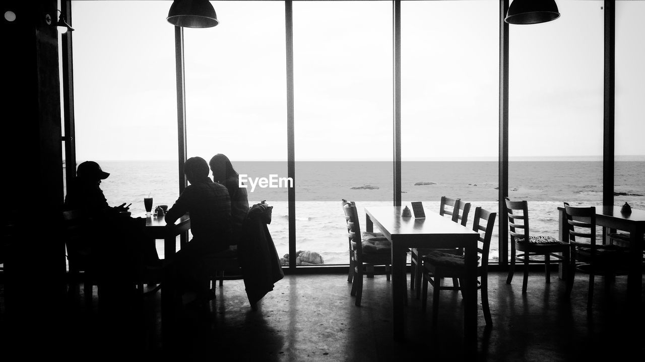 PEOPLE SITTING IN RESTAURANT AT SEA