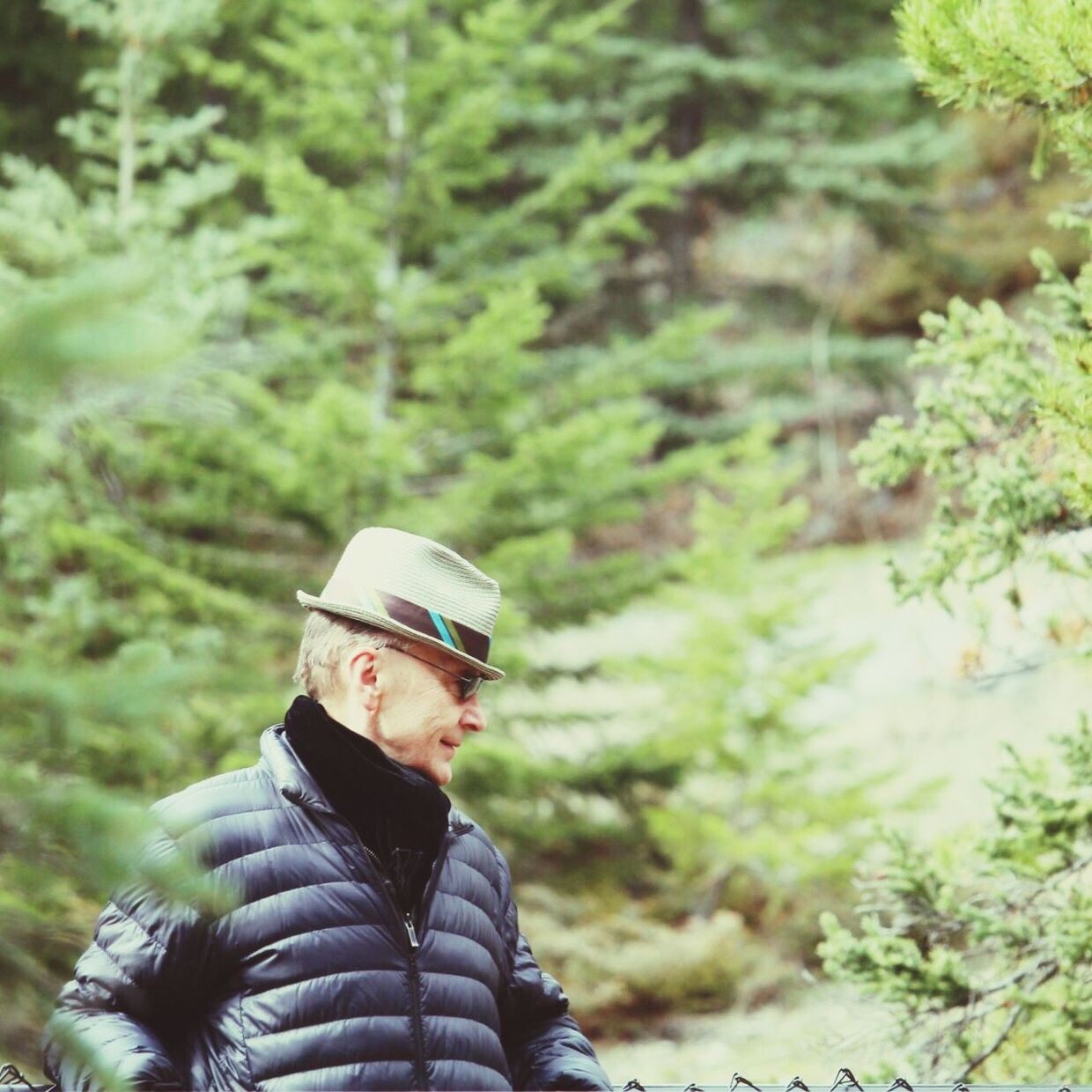 Man standing against trees