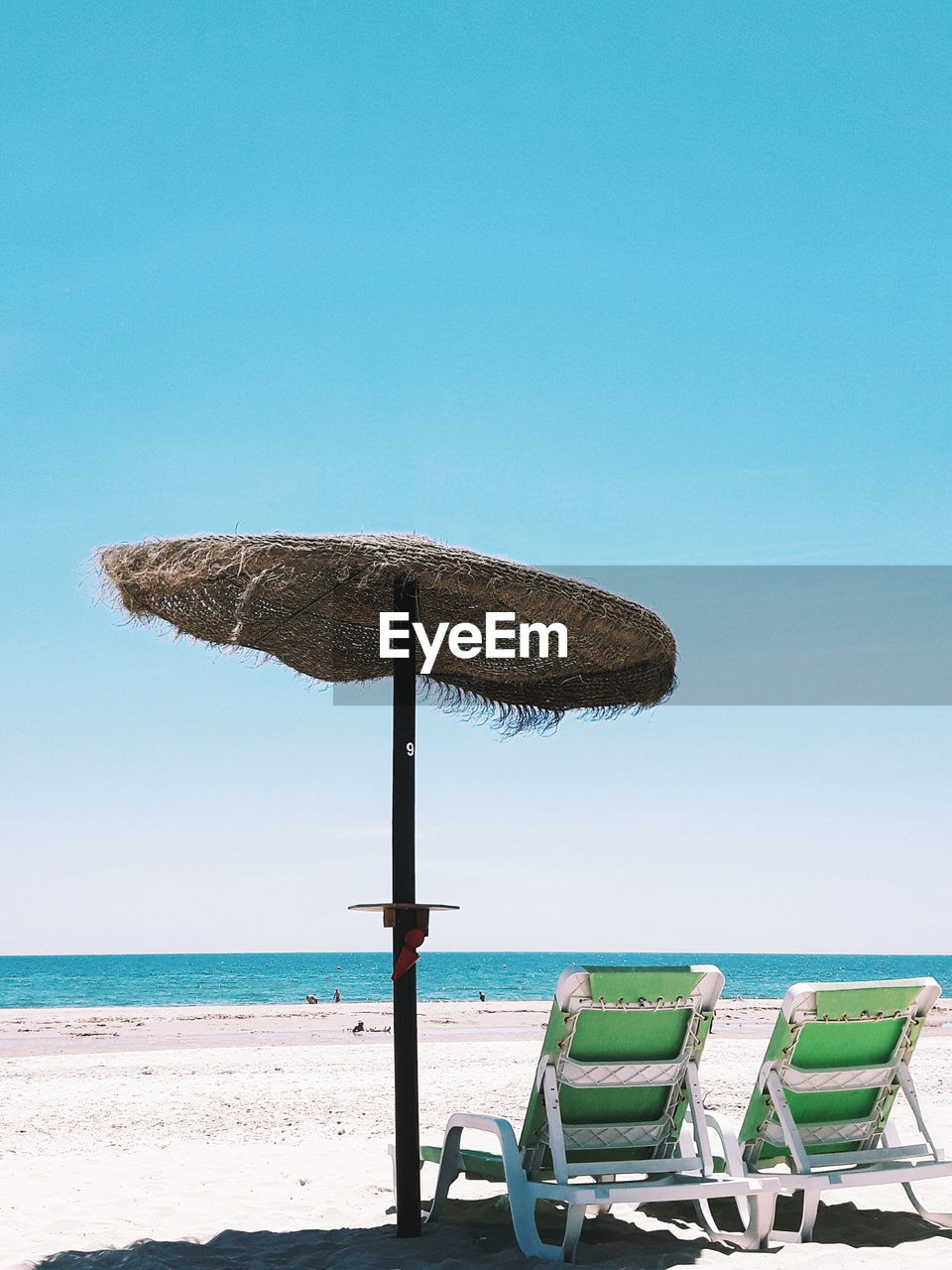 Scenic view of beach against clear sky