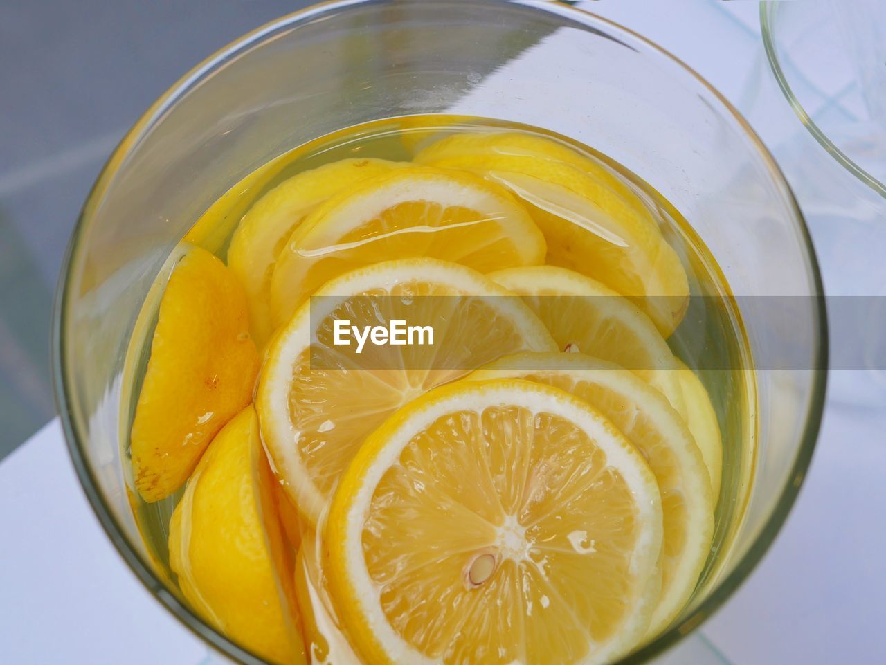 Close-up of lemon in glass on table