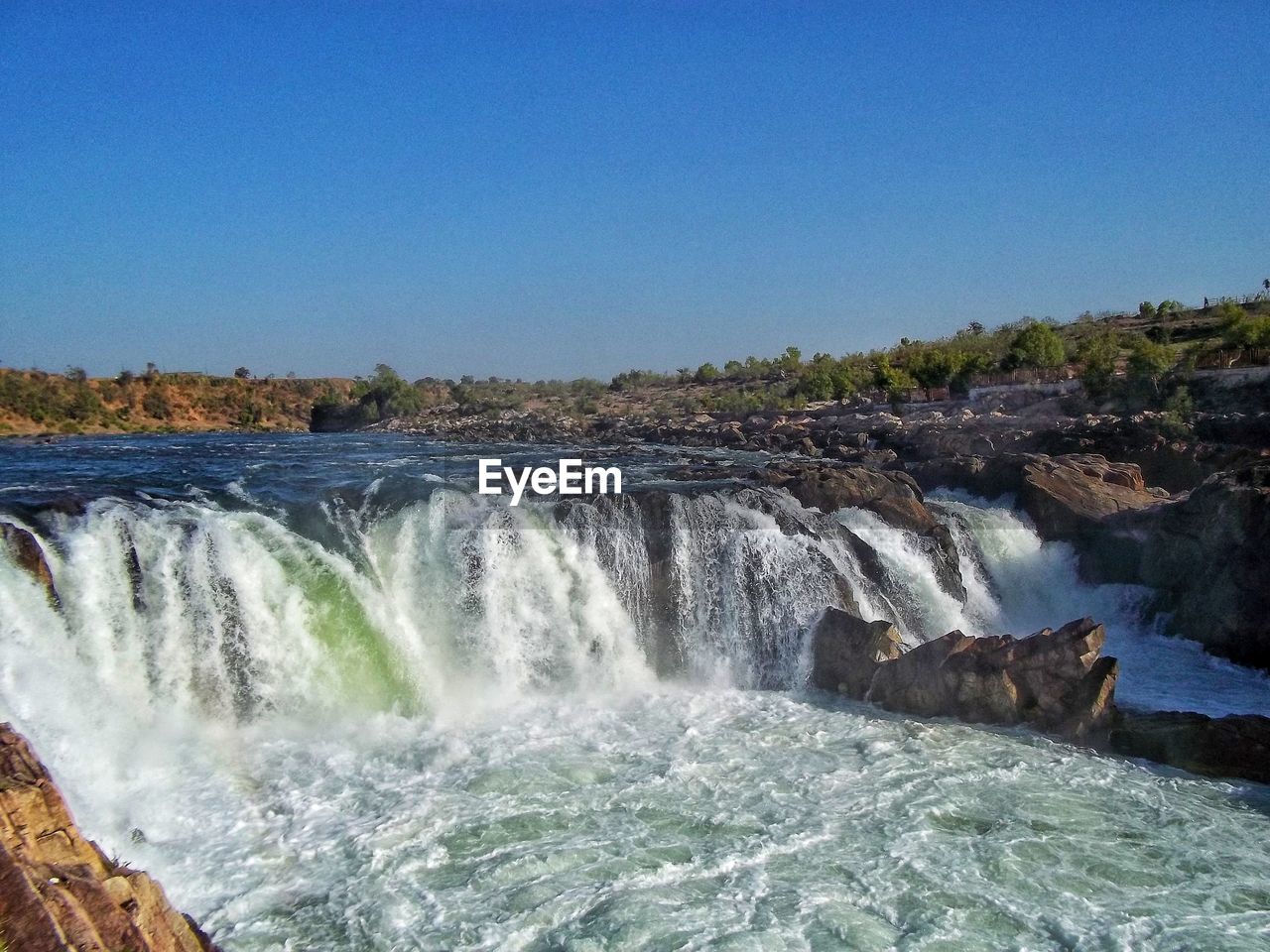 WATER SPLASHING AGAINST WATERFALL