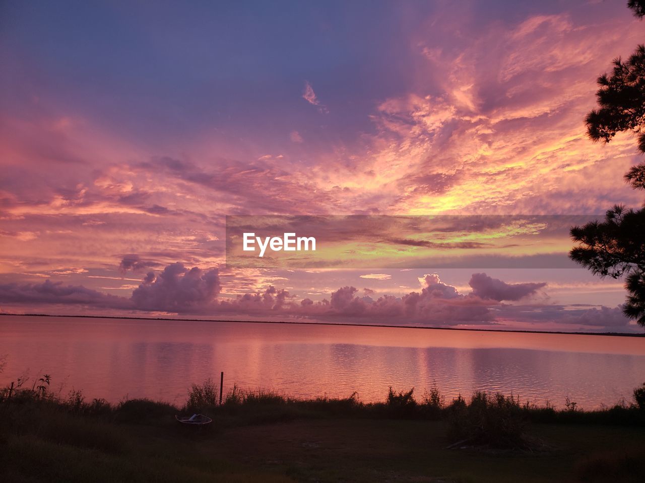 SCENIC VIEW OF LAKE DURING SUNSET