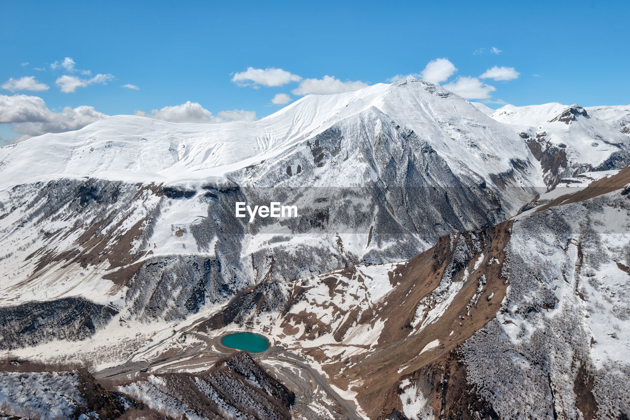 SNOWCAPPED MOUNTAINS AGAINST SKY