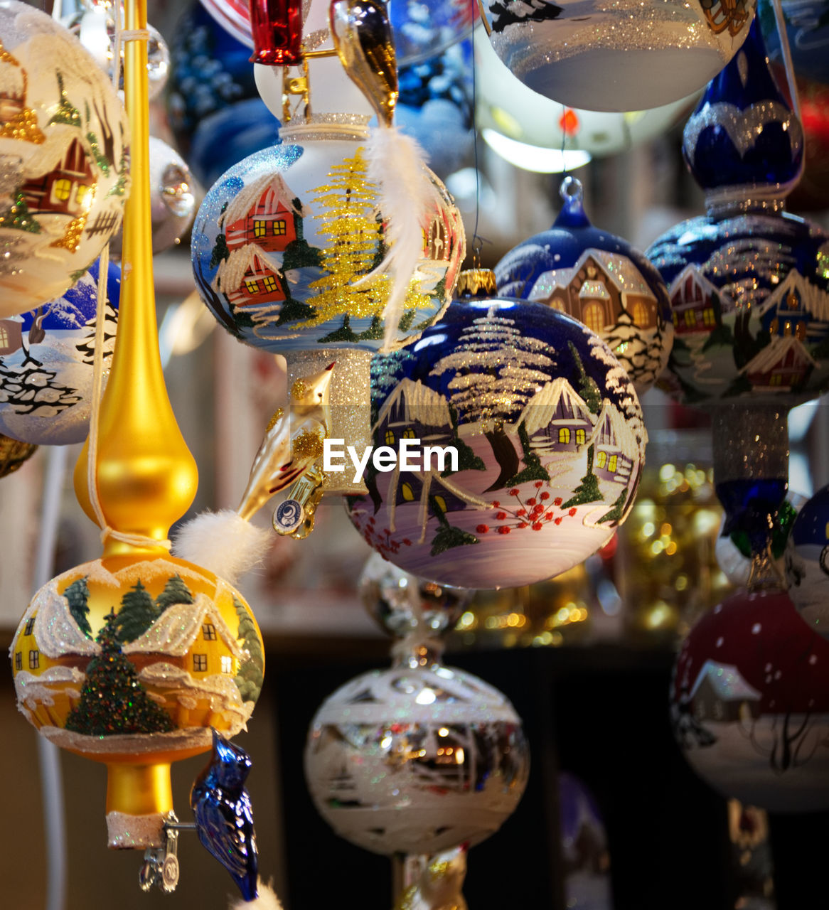 CLOSE-UP OF DECORATIONS HANGING AT MARKET STALL