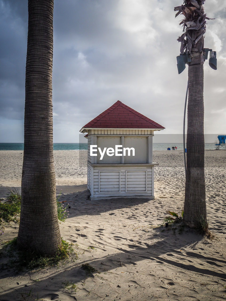 View of cloudy sky over kiosk on beach