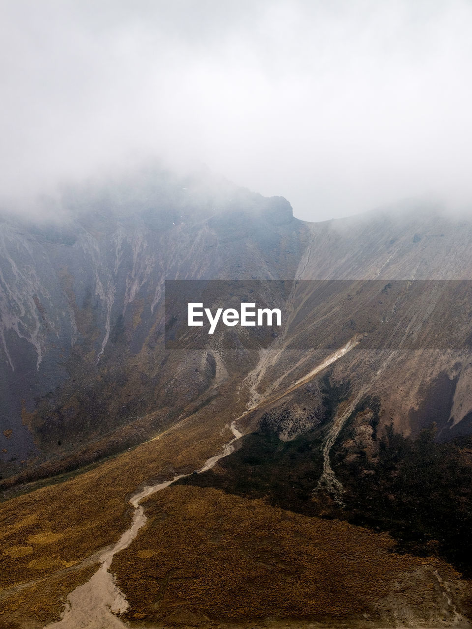 SCENIC VIEW OF MOUNTAINS DURING FOGGY WEATHER