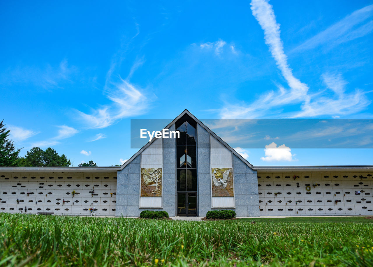 EXTERIOR OF TEMPLE AGAINST BUILDING