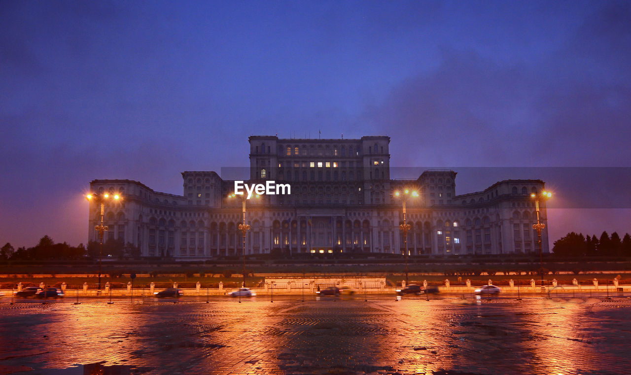 View of illuminated palace of parliament at night, bucharest - romania