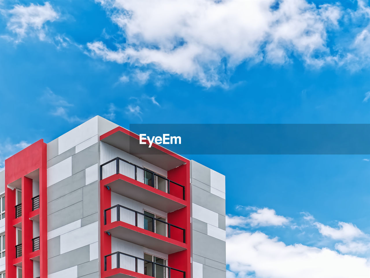 architecture, building exterior, sky, building, cloud, built structure, tower block, red, blue, city, home ownership, business, window, nature, industry, residential district, cloudscape, house, outdoors, no people, white, facade, healthcare and medicine, vibrant color, large, apartment, commercial building, construction industry, retail