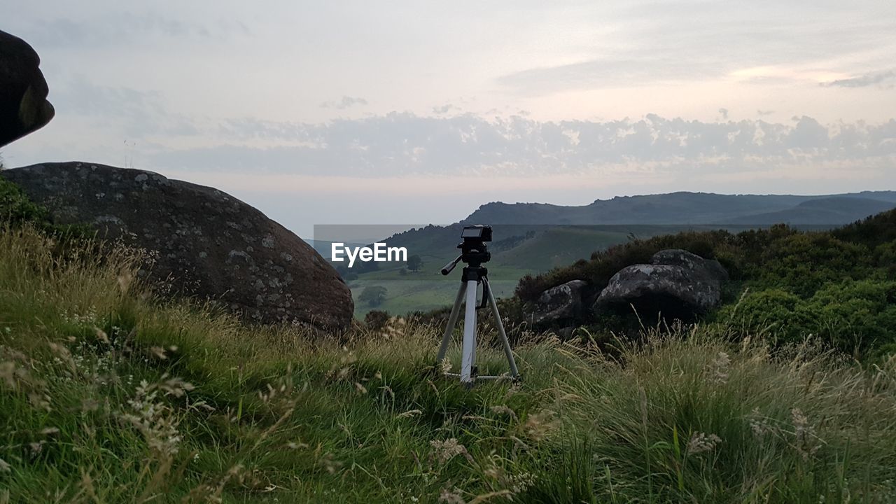 SCENIC VIEW OF GRASSY FIELD AGAINST SKY