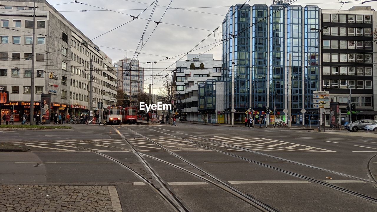 CITY STREET AND BUILDINGS AGAINST SKY