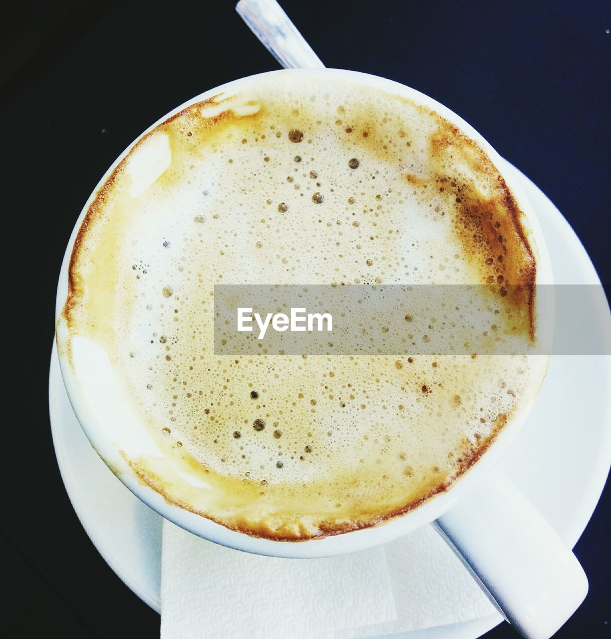 CLOSE-UP OF COFFEE CUP ON TABLE