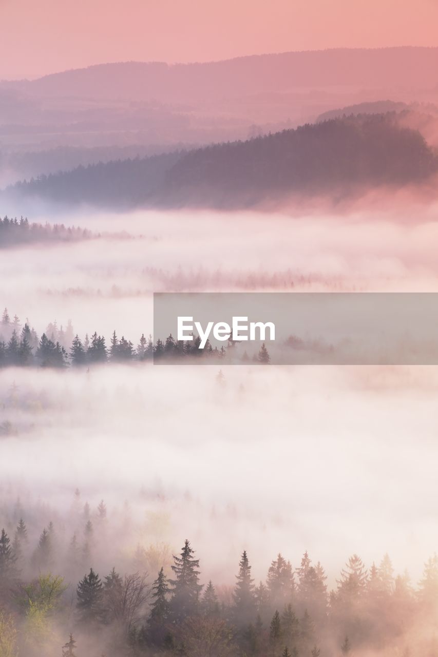 Scenic view of mountains against sky during sunset