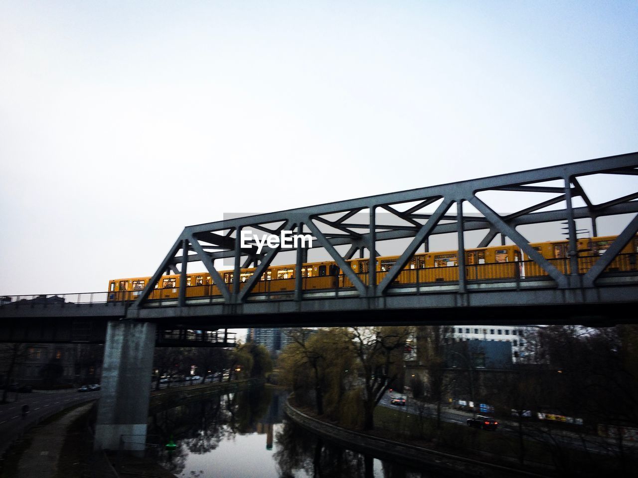 RAILWAY BRIDGE OVER RIVER AGAINST SKY