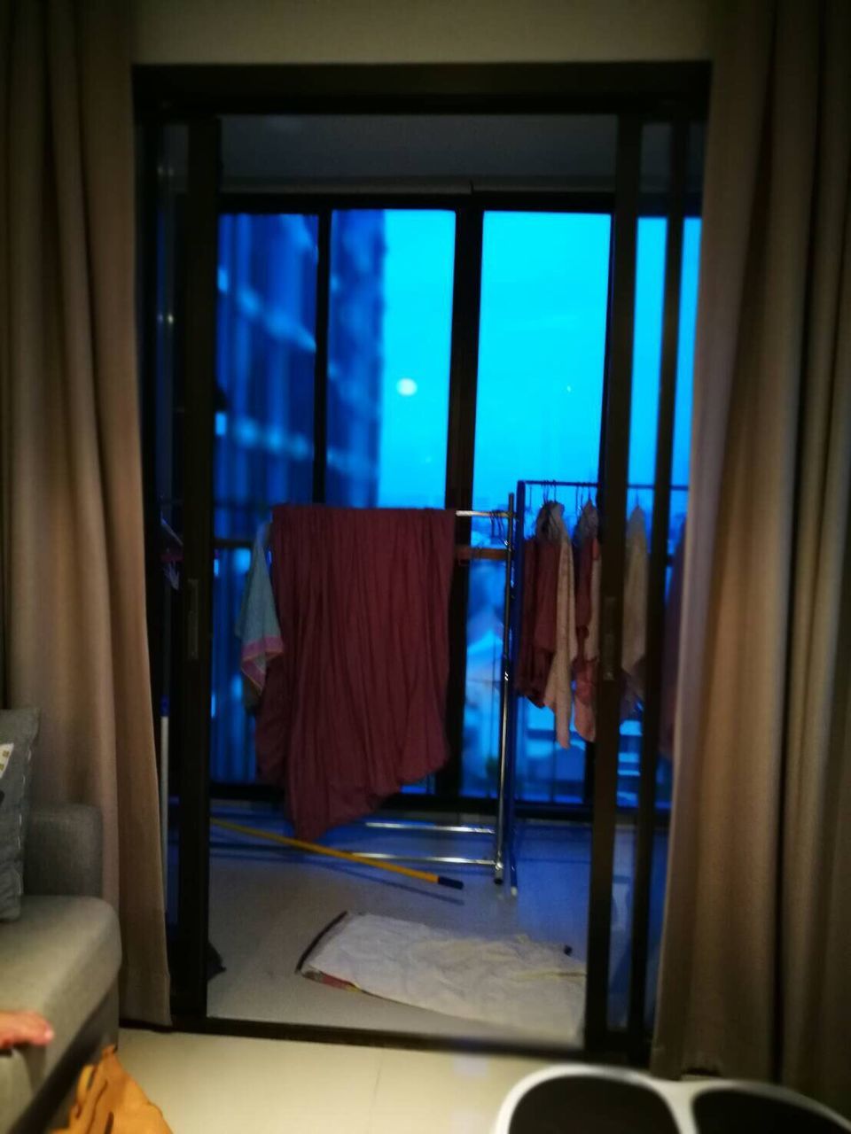 VIEW OF BLUE WINDOW IN ROOM