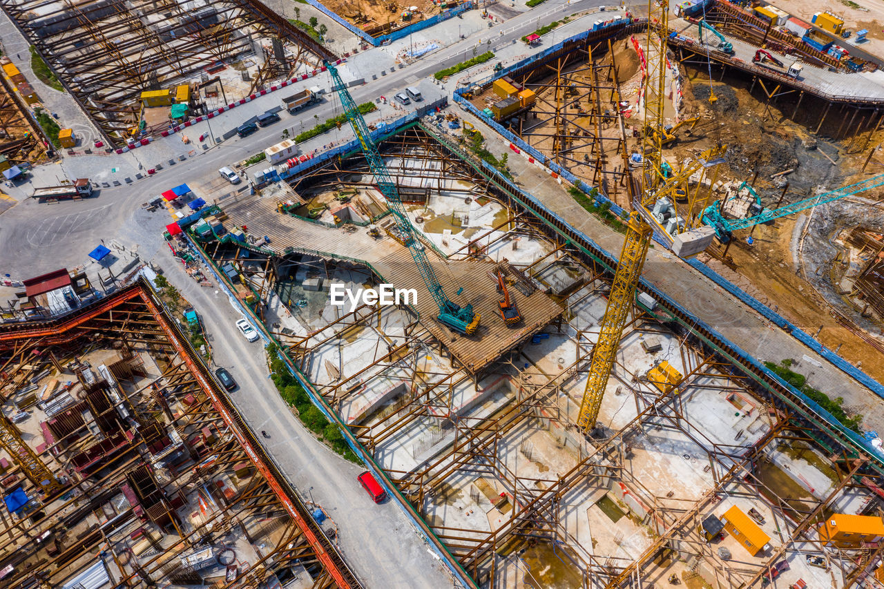 HIGH ANGLE VIEW OF CONSTRUCTION SITE ON CITY STREET