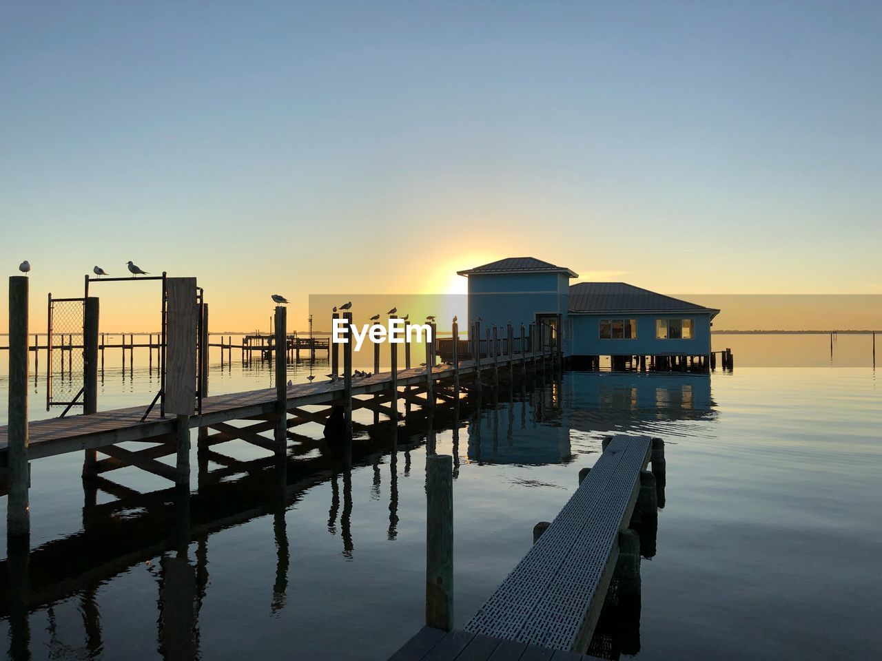 PIER ON SEA AGAINST CLEAR SKY