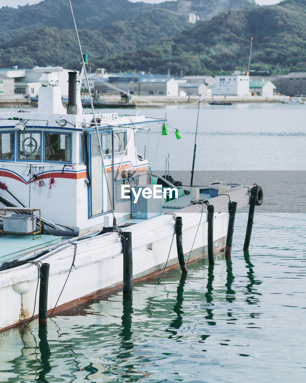 BOATS MOORED IN SEA