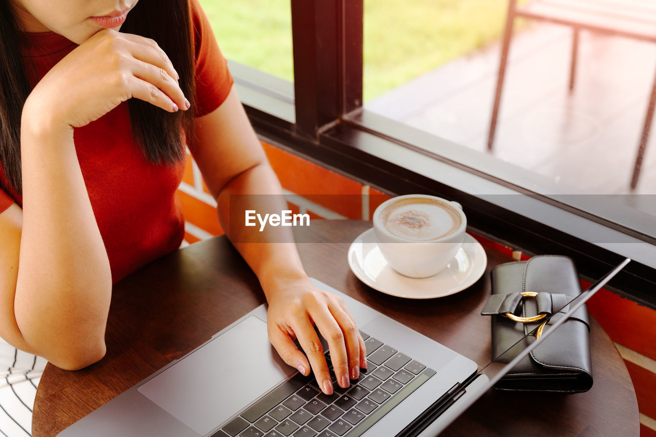 Woman hands typing on laptop keyboard. woman working at office w