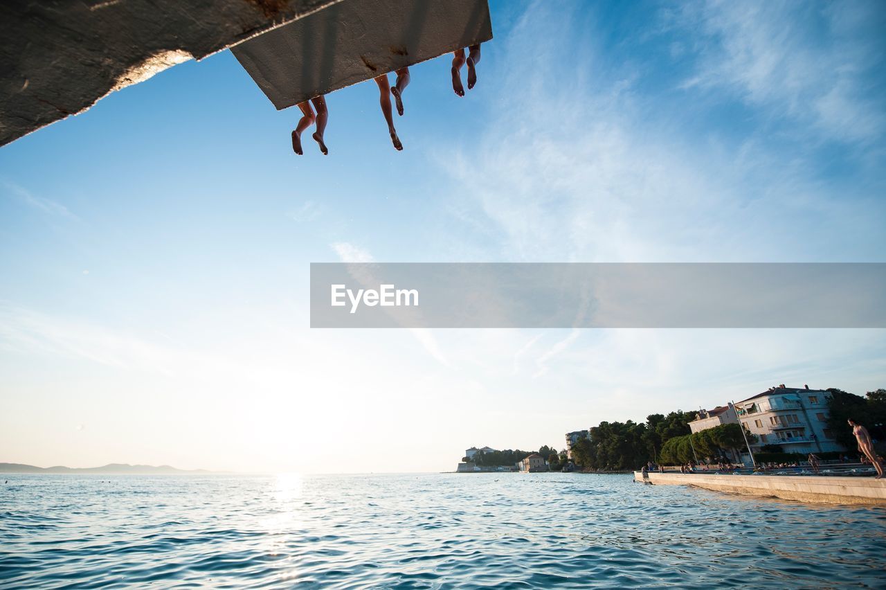 VIEW OF CALM SEA AGAINST SKY