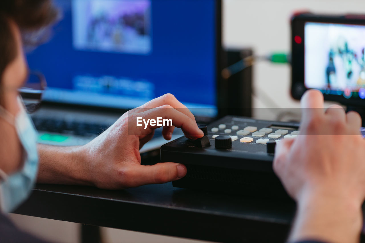 Midsection of man using keyboard