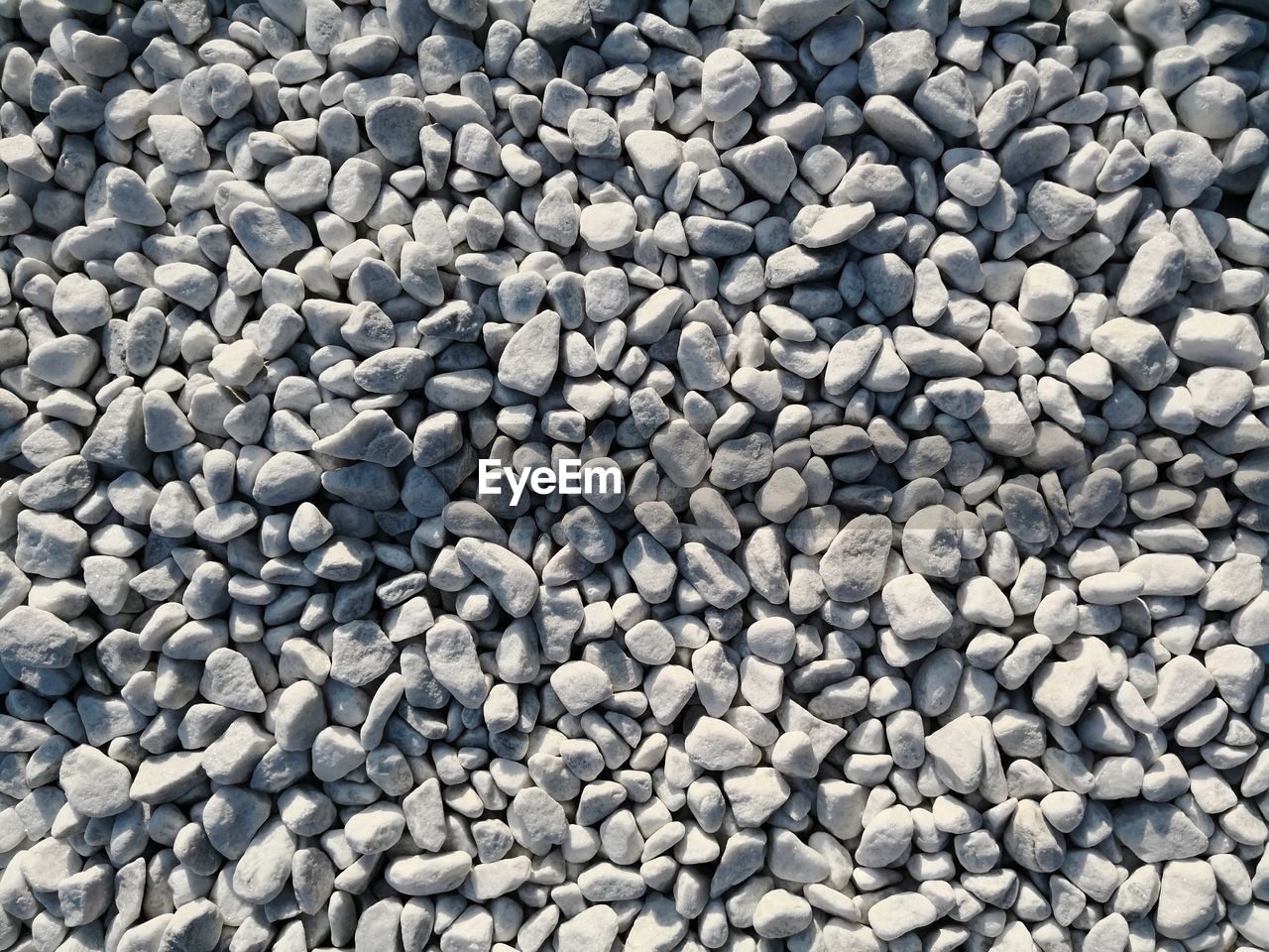 High angle view of stones on pebbles