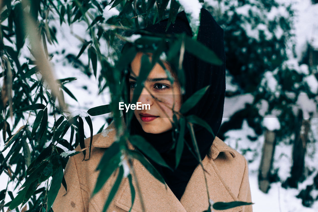 Portrait of young woman in winter