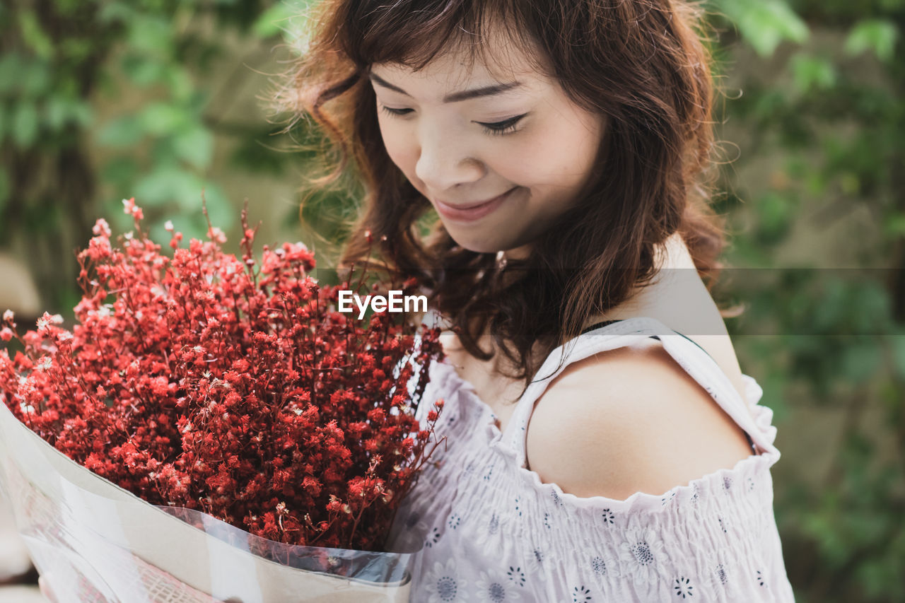 Young woman looking away outdoors