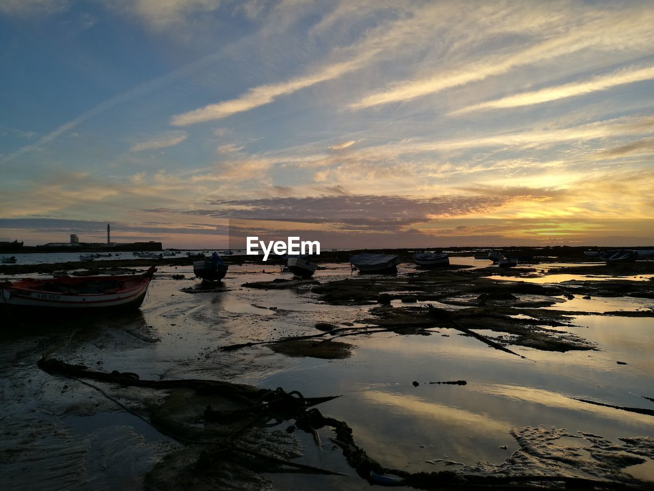 BOATS MOORED ON SEA AGAINST SKY