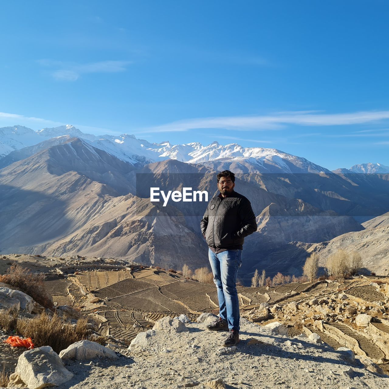 rear view of man standing on mountain