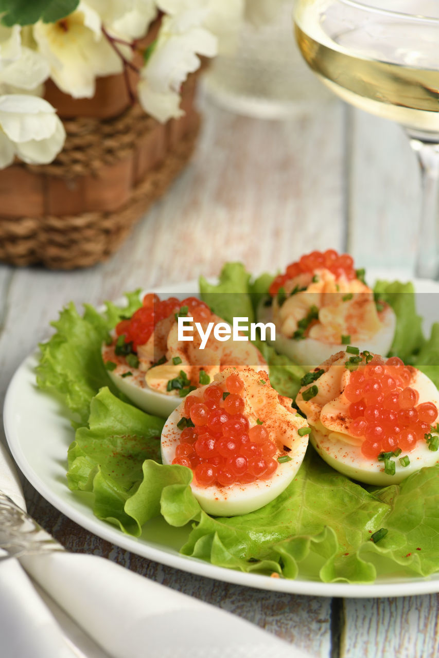 Stuffed eggs with salmon caviar are a popular appetizer for any occasion.  