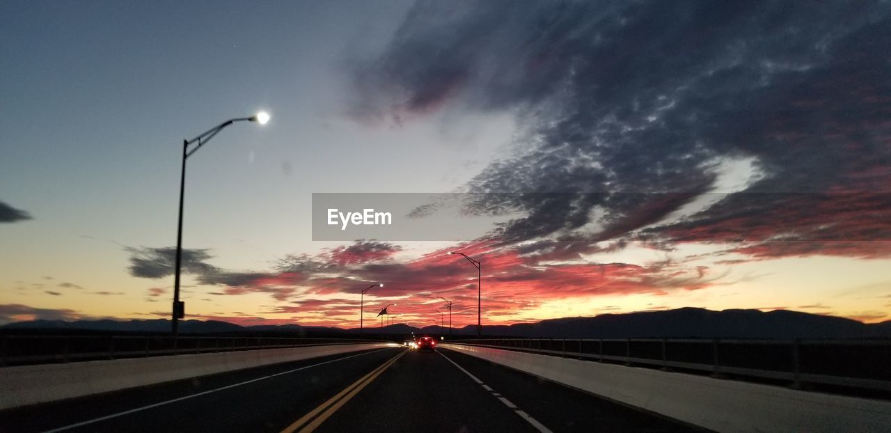 HIGHWAY AGAINST SKY DURING SUNSET