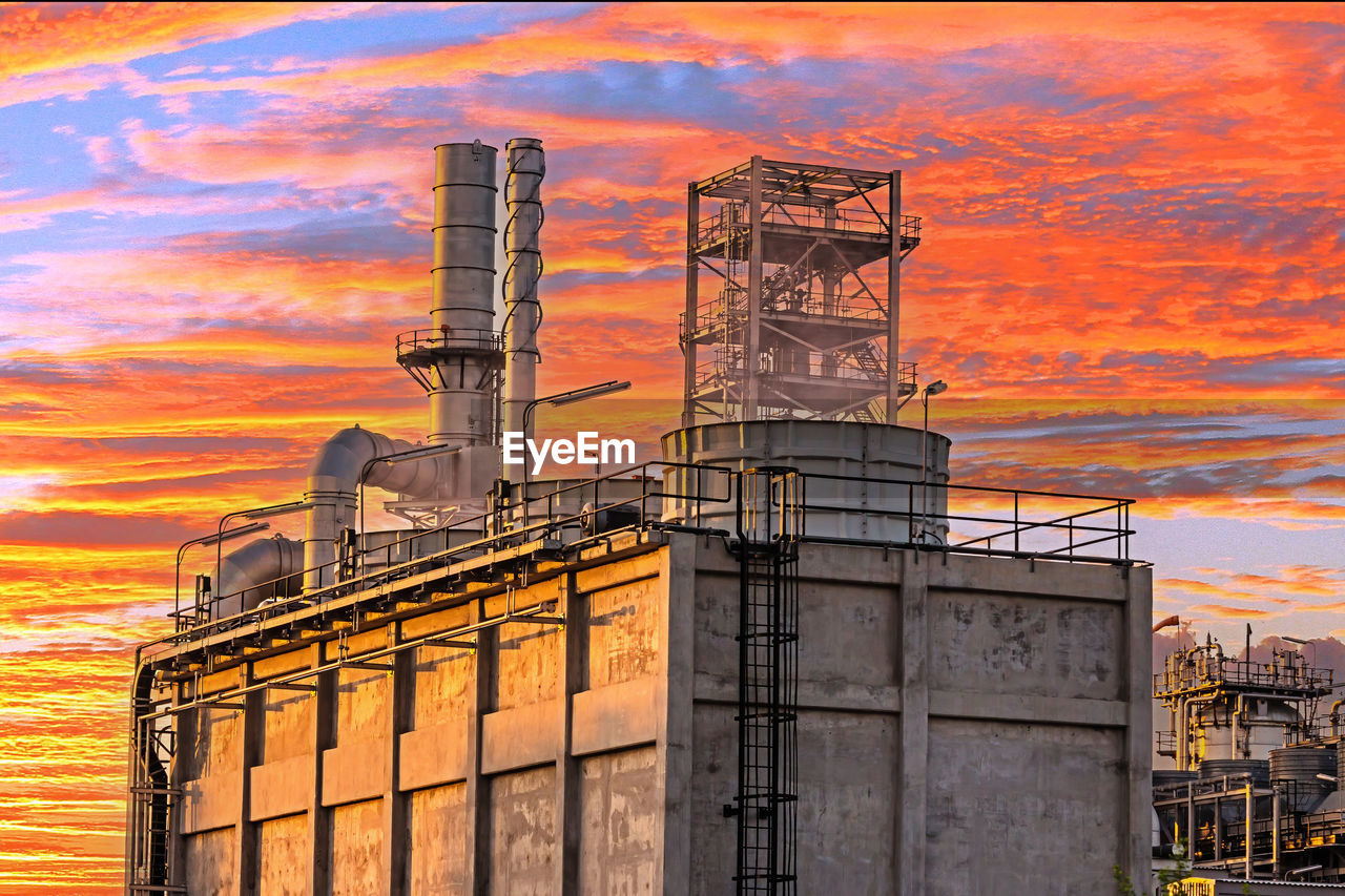 Refinery tower in petrochemical industrial plant with twilight.