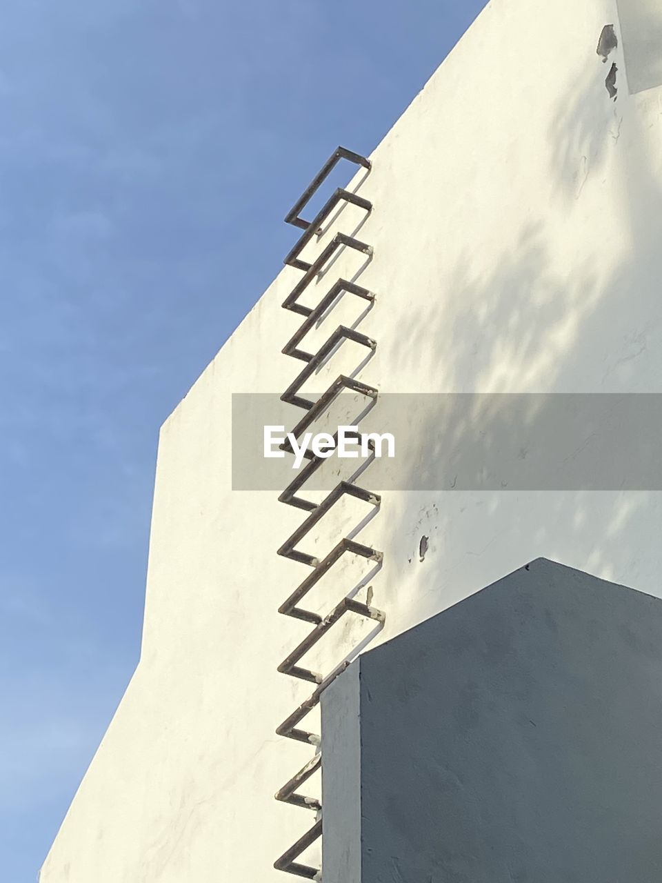 Low angle view of building against clear blue sky