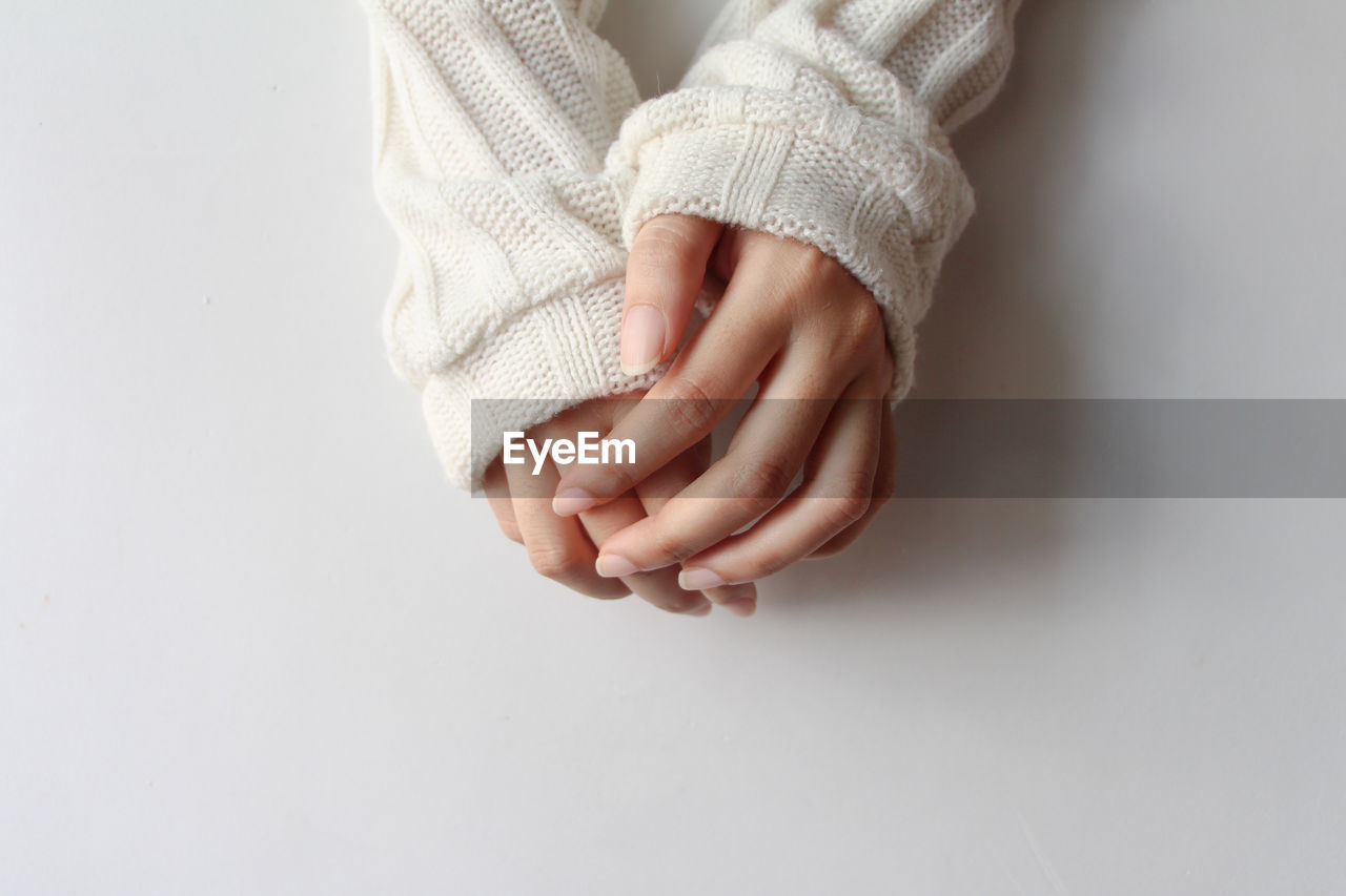 hand, finger, indoors, one person, baby, studio shot, women, adult, clothing, child, limb, human leg, arm, copy space, childhood, close-up, white, female, fashion accessory, white background, toddler, human limb