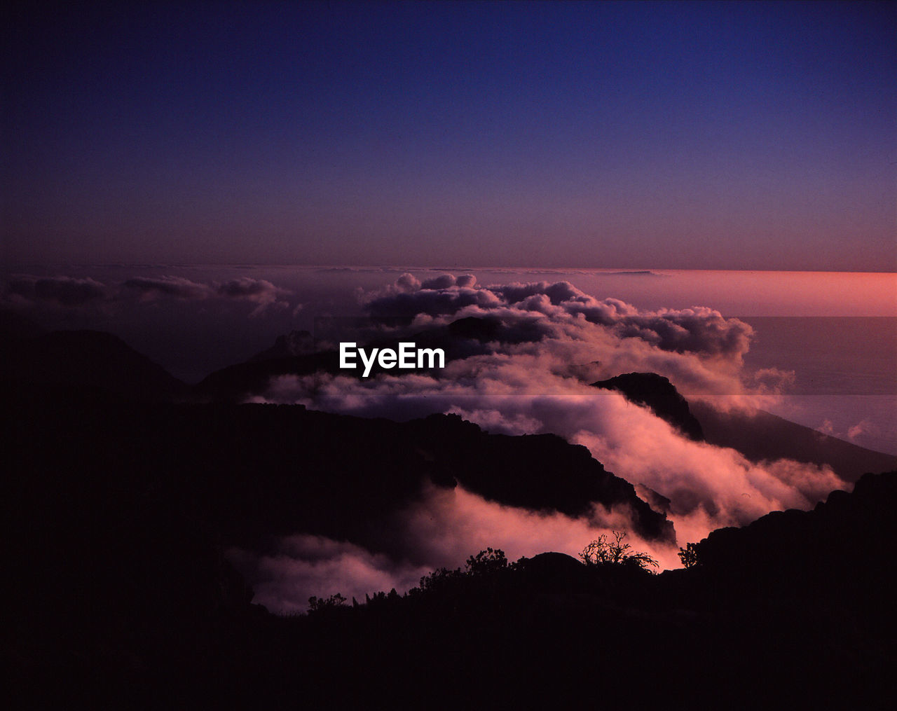 Scenic view of cloudscape against sky at sunset