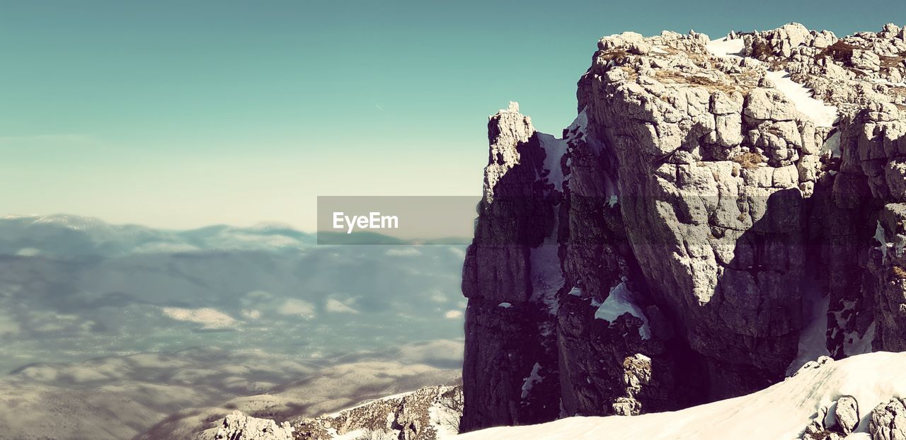 Scenic view of rock formations against sky