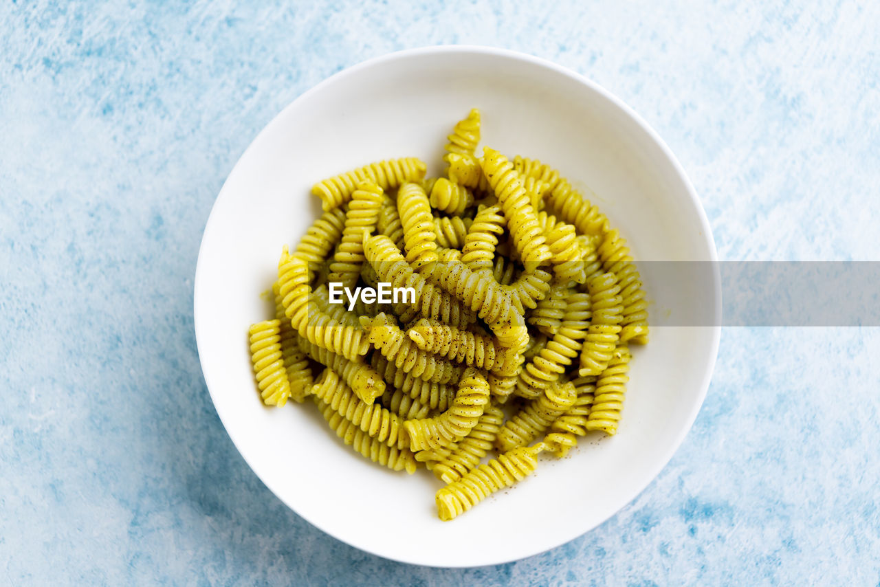 food and drink, food, healthy eating, pasta, wellbeing, italian food, produce, freshness, directly above, indoors, no people, studio shot, plate, dish, yellow, high angle view, vegetable, raw food, still life, plant, table