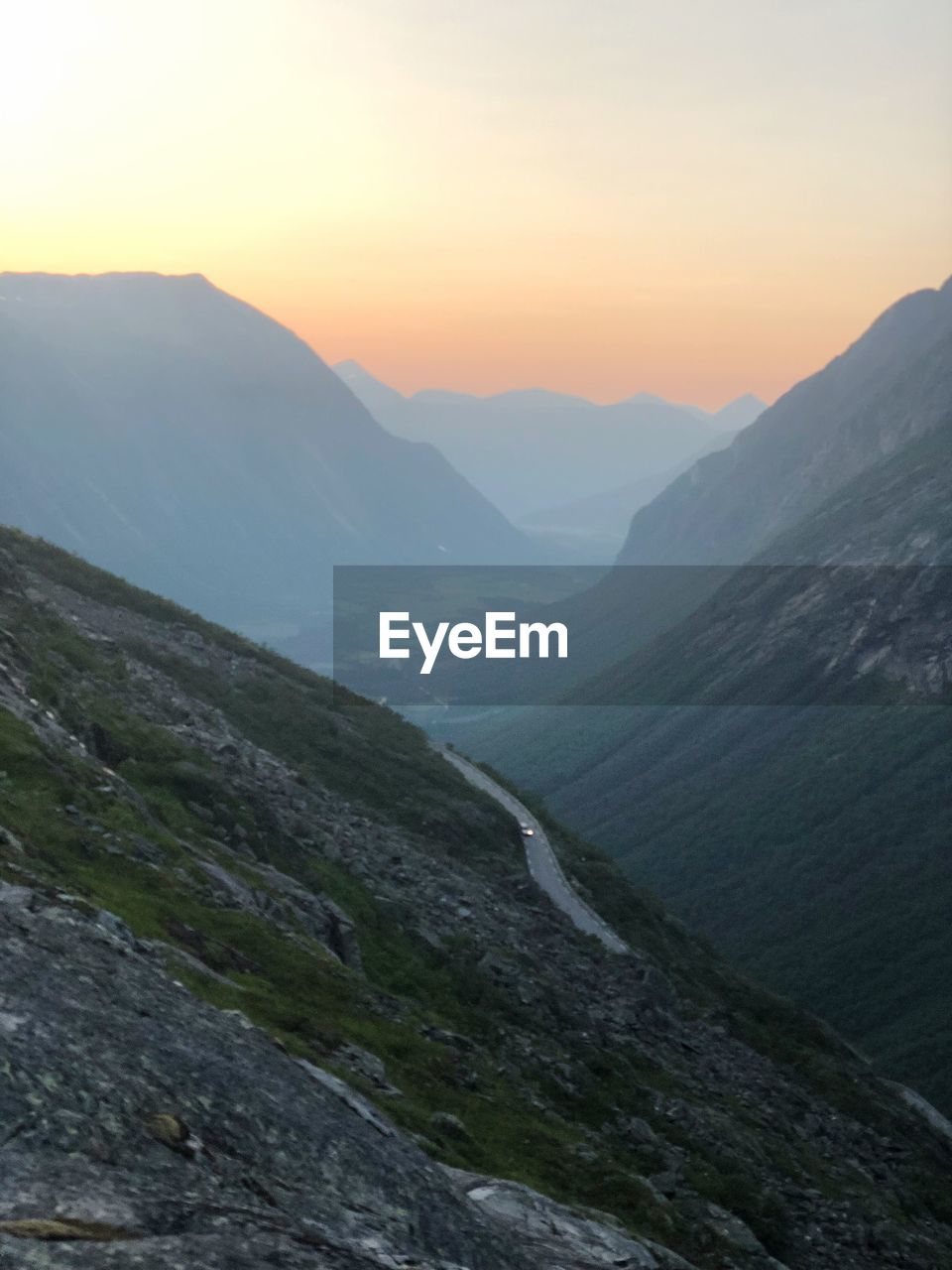 Scenic view of mountains against sky during sunset