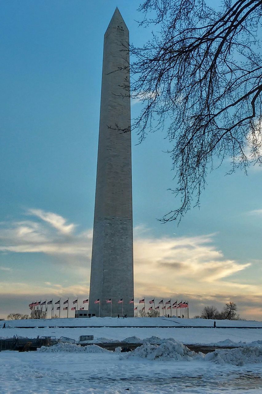 Low angle view of washington monument against sky during winter