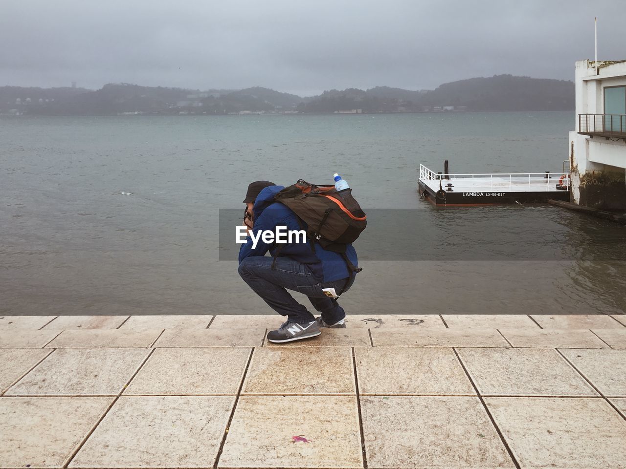 WOMAN STANDING IN WATER