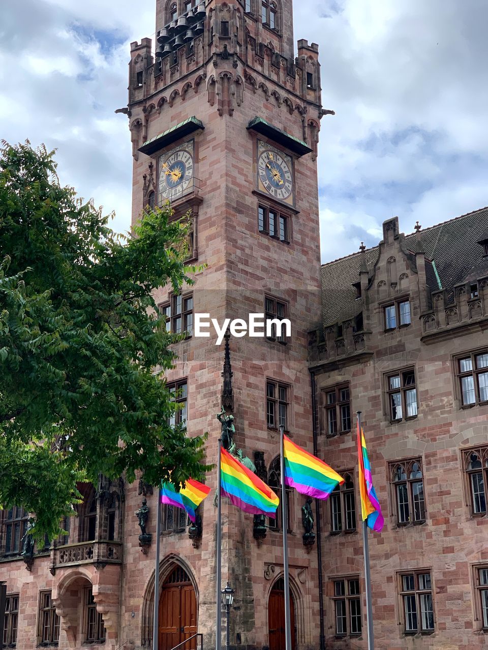 Low angle view of building against cloudy sky